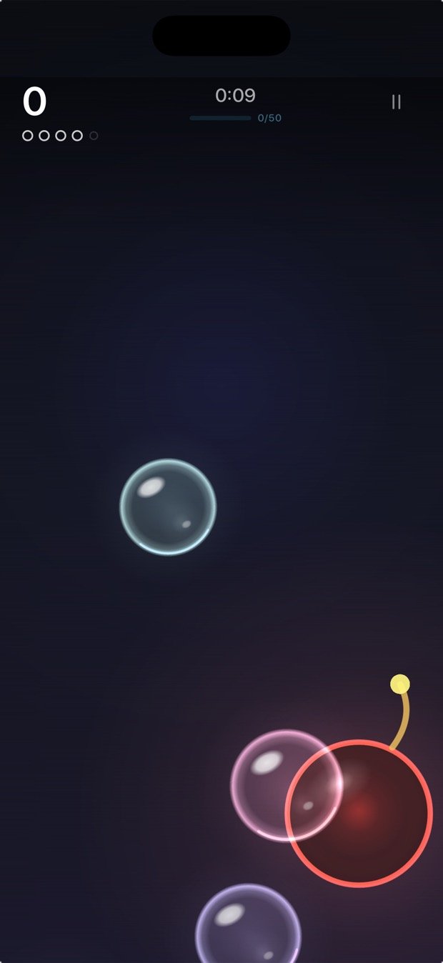 2.0 in play: translucent teal, pink and violet bubbles with bright rims, and a red bomb trailing a lit fuse.